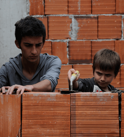 Forgive_3 Nik (Tristan Halilaj) and his best friend Tom (Erjon Mani) hangout after school in Joshua Marston's THE FORGIVENESS OF BLOOD. Photo credit Anila Jaho. A Sundance Selects release.