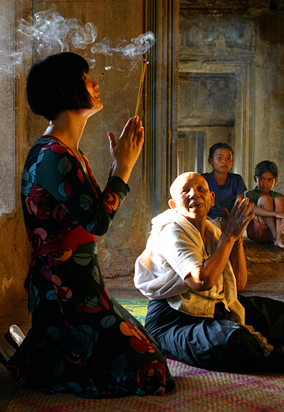 <em>Praying at Angkor Wat, Cambodia</em>, Andy Schrock Photography
